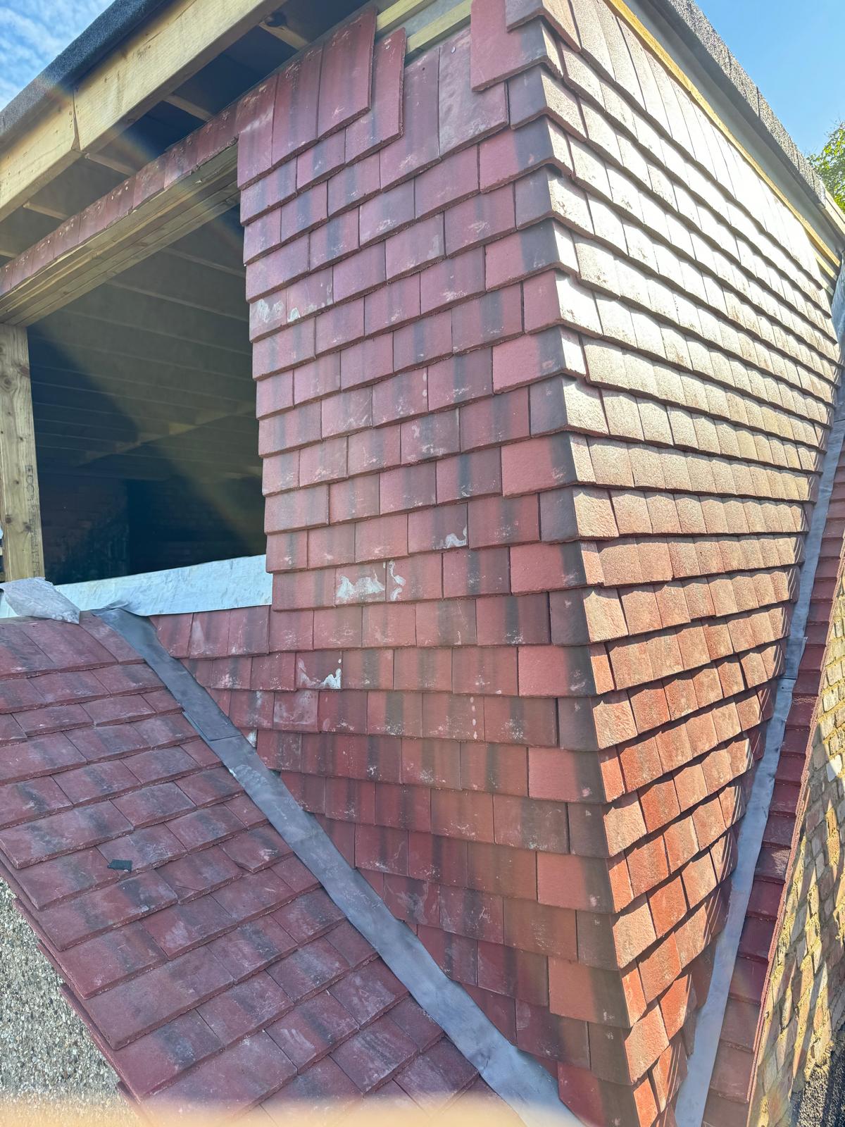 Vertical tile hanging on dormer